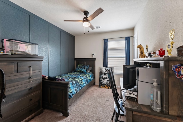 14706 Meadow Acre Trl, Houston, TX 77049 - bedroom featuring carpet, ceiling fan, a textured wall, and a textured ceiling