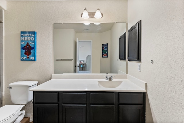14706 Meadow Acre Trl, Houston, TX 77049 - bathroom with toilet, vanity, and a textured wall