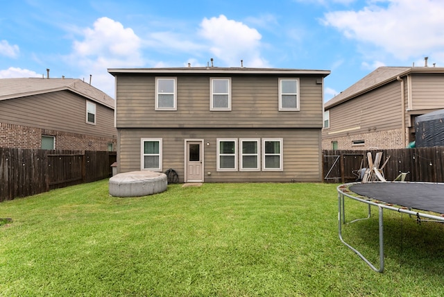 14706 Meadow Acre Trl, Houston, TX 77049 - rear view of property featuring a trampoline
