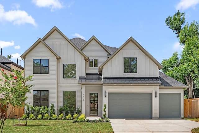 7913 Turquoise Ln, Houston, TX 77055 - view of front of house with driveway, a shingled roof, a standing seam roof, board and batten siding, and a garage