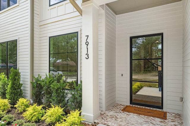 7913 Turquoise Ln, Houston, TX 77055 - doorway to property featuring board and batten siding