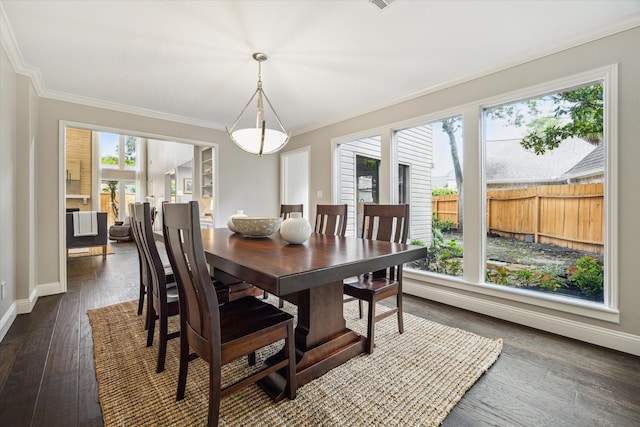 706 St Ives Ct, Houston, TX 77079 - dining space with ornamental molding, dark wood-style floors, and baseboards