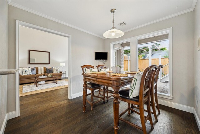 706 St Ives Ct, Houston, TX 77079 - dining room with baseboards, ornamental molding, and dark wood finished floors