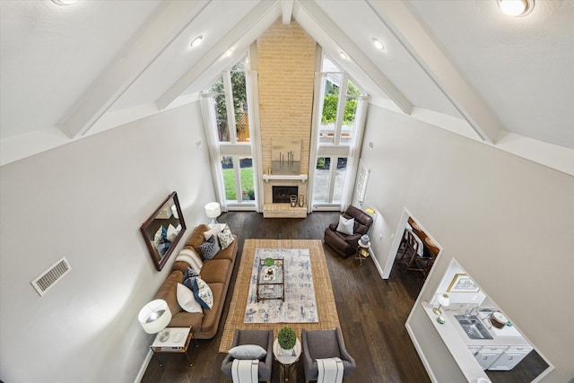 706 St Ives Ct, Houston, TX 77079 - living area featuring a large fireplace, wood finished floors, and baseboards