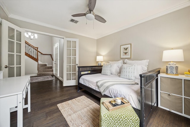 706 St Ives Ct, Houston, TX 77079 - bedroom with ornamental molding, dark wood-style flooring, french doors, a chandelier, and a ceiling fan