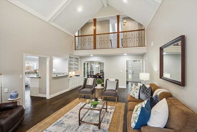 706 St Ives Ct, Houston, TX 77079 - living room featuring beamed ceiling, dark wood-type flooring, high vaulted ceiling, and baseboards