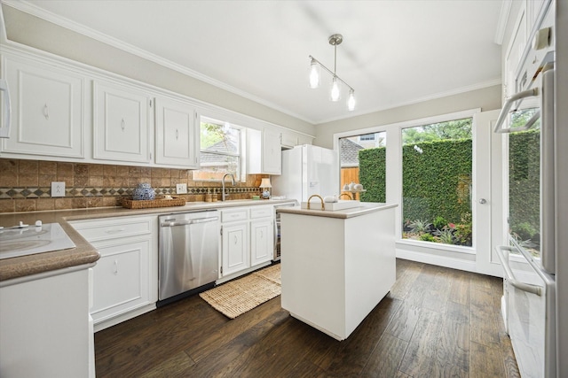 706 St Ives Ct, Houston, TX 77079 - kitchen with white appliances, white cabinetry, dark wood finished floors, backsplash, and ornamental molding