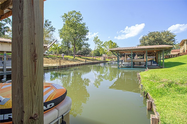 374 Harbor View Dr, Livingston, TX 77351 - dock featuring a water view, a lawn, and boat lift