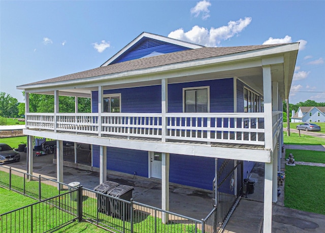 374 Harbor View Dr, Livingston, TX 77351 - view of side of home with roof with shingles and a patio