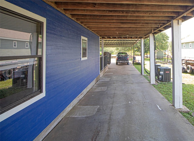 374 Harbor View Dr, Livingston, TX 77351 - view of patio / terrace with central AC and an attached carport