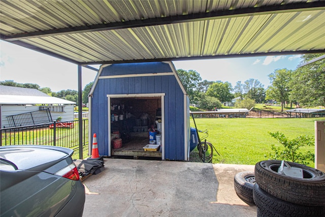 374 Harbor View Dr, Livingston, TX 77351 - garage featuring a shed