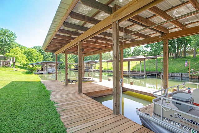 374 Harbor View Dr, Livingston, TX 77351 - dock area with a water view, boat lift, and a yard