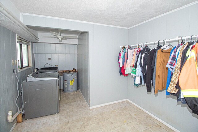 374 Harbor View Dr, Livingston, TX 77351 - laundry area featuring electric water heater, separate washer and dryer, ceiling fan, a textured ceiling, and baseboards
