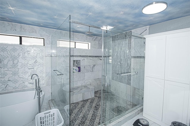 374 Harbor View Dr, Livingston, TX 77351 - bathroom featuring a freestanding bath and a stall shower