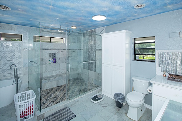 374 Harbor View Dr, Livingston, TX 77351 - full bathroom with a shower stall, toilet, a soaking tub, and vanity