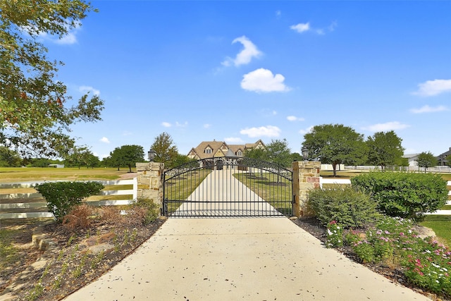 624 High Meadow Ranch Dr, Magnolia, TX 77355 - gate featuring a water view