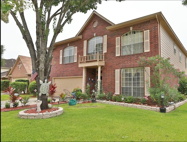 4915 Dove Springs Dr, Houston, TX 77066 - view of front of home featuring an attached garage, brick siding, a front yard, and a balcony