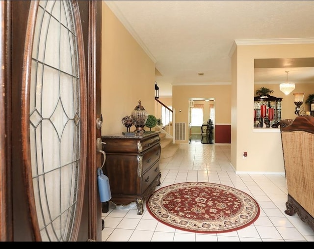 4915 Dove Springs Dr, Houston, TX 77066 - foyer entrance featuring stairway, light tile patterned floors, crown molding, and baseboards