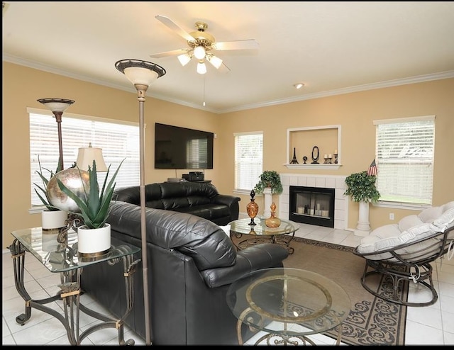4915 Dove Springs Dr, Houston, TX 77066 - living area featuring light tile patterned flooring, a ceiling fan, crown molding, and a tile fireplace