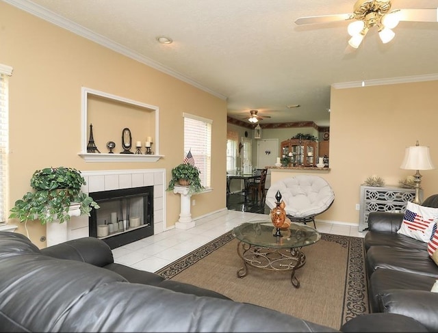 4915 Dove Springs Dr, Houston, TX 77066 - tiled living room with ceiling fan, a tiled fireplace, crown molding, and baseboards