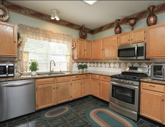 4915 Dove Springs Dr, Houston, TX 77066 - kitchen featuring appliances with stainless steel finishes, a sink, backsplash, and dark stone counters