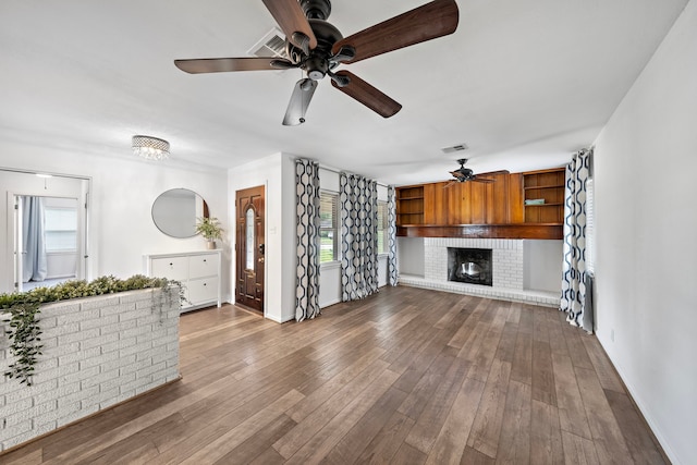 4922 Nina Lee Ln, Houston, TX 77092 - unfurnished living room featuring ceiling fan, baseboards, healthy amount of natural light, and wood finished floors