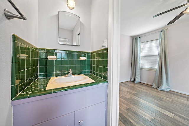 4922 Nina Lee Ln, Houston, TX 77092 - bathroom featuring a ceiling fan, vanity, wood finished floors, and baseboards