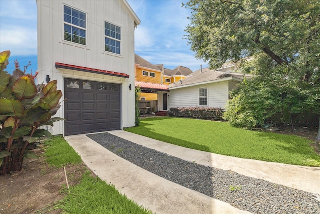 529 Fugate St, Houston, TX 77009 - view of front of house featuring board and batten siding, a garage, a front lawn, and concrete driveway