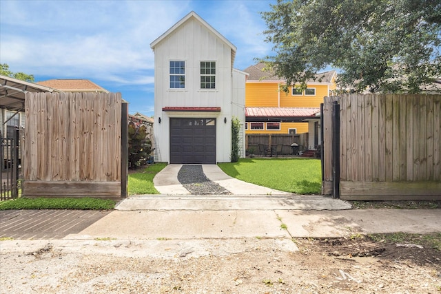 529 Fugate St, Houston, TX 77009 - view of front of house featuring a garage, board and batten siding, and driveway