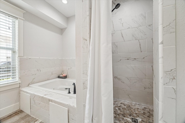 529 Fugate St, Houston, TX 77009 - bathroom featuring a garden tub, tiled shower, and plenty of natural light