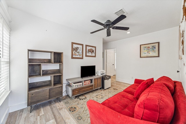 529 Fugate St, Houston, TX 77009 - living area featuring light wood-type flooring, a ceiling fan, recessed lighting, healthy amount of natural light, and baseboards