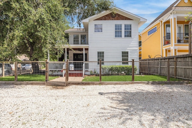 529 Fugate St, Houston, TX 77009 - view of front facade with a porch, a fenced front yard, a gate, and a ceiling fan