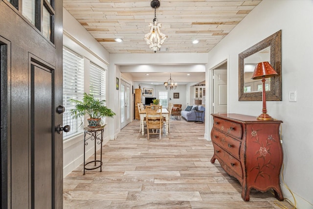 529 Fugate St, Houston, TX 77009 - foyer entrance with a chandelier, light wood-style flooring, recessed lighting, wooden ceiling, and baseboards