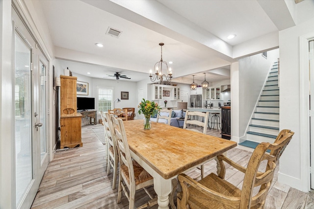 529 Fugate St, Houston, TX 77009 - dining room featuring stairway, light wood finished floors, baseboards, a chandelier, and recessed lighting