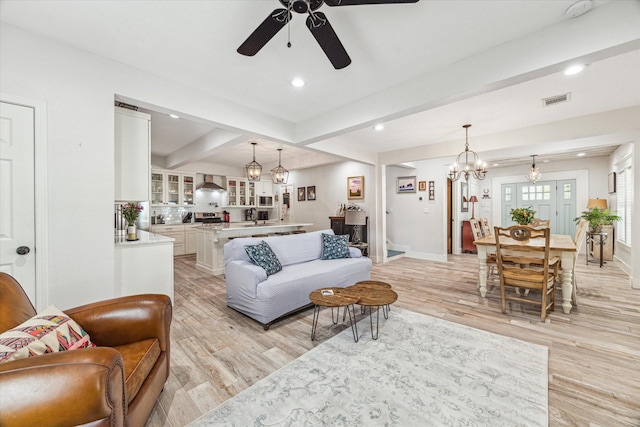 529 Fugate St, Houston, TX 77009 - living area featuring beamed ceiling, light wood finished floors, a ceiling fan, recessed lighting, and baseboards