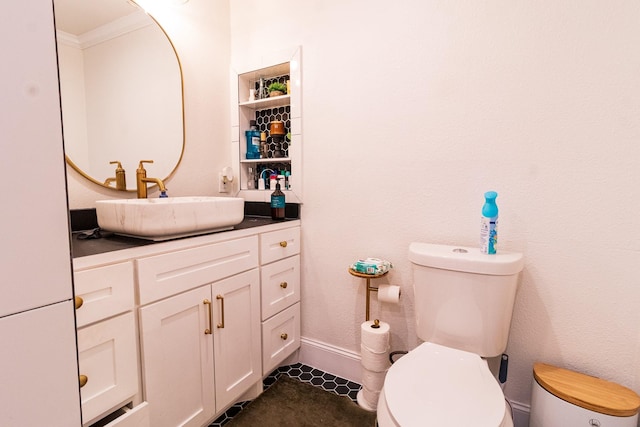 326 W 28th St, Houston, TX 77008 - bathroom featuring toilet, vanity, crown molding, baseboards, and tile patterned flooring