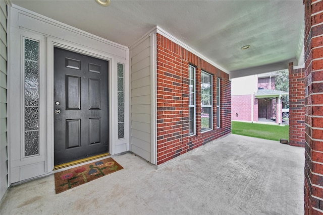 32126 Willow Creek Park, Conroe, TX 77385 - doorway to property with covered porch and brick siding
