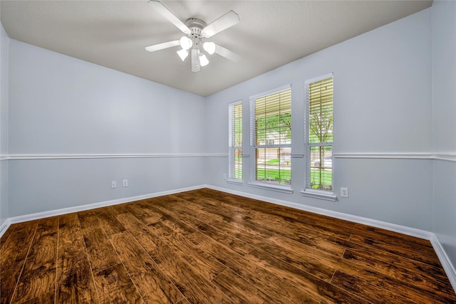 32126 Willow Creek Park, Conroe, TX 77385 - unfurnished room with dark wood finished floors and a ceiling fan