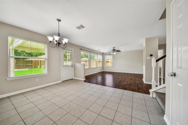 32126 Willow Creek Park, Conroe, TX 77385 - empty room featuring stairs, light tile patterned flooring, a chandelier, and a ceiling fan