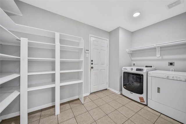 32126 Willow Creek Park, Conroe, TX 77385 - laundry area featuring light tile patterned floors and separate washer and dryer