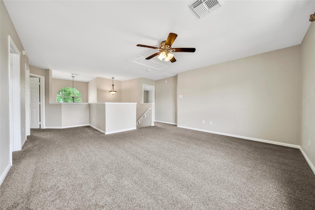 32126 Willow Creek Park, Conroe, TX 77385 - unfurnished room featuring a ceiling fan, carpet floors, and attic access