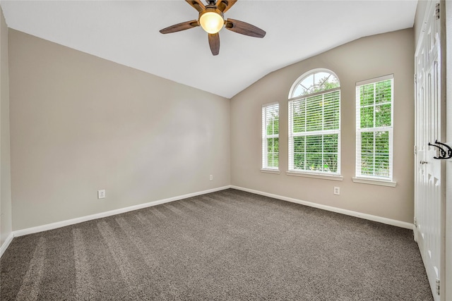 32126 Willow Creek Park, Conroe, TX 77385 - unfurnished room with vaulted ceiling, dark colored carpet, and ceiling fan