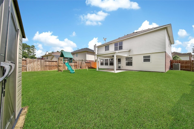32126 Willow Creek Park, Conroe, TX 77385 - rear view of property featuring a patio area, a playground, and a fenced backyard