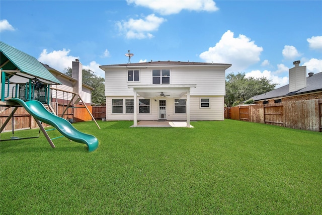 32126 Willow Creek Park, Conroe, TX 77385 - back of house featuring a fenced backyard, a playground, ceiling fan, and a patio