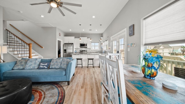 21530 San Luis Pass Rd, Galveston, TX 77554 - living area featuring a ceiling fan, light wood-style floors, recessed lighting, and stairs