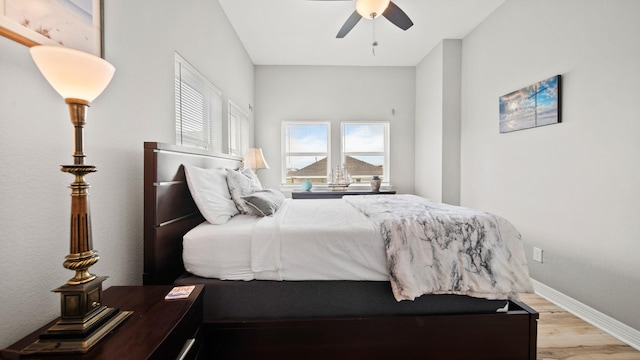21530 San Luis Pass Rd, Galveston, TX 77554 - bedroom with wood finished floors, a ceiling fan, and baseboards