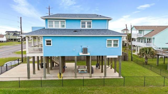 21530 San Luis Pass Rd, Galveston, TX 77554 - rear view of property with a shingled roof, central air condition unit, stairs, and a patio area