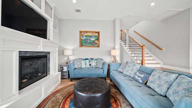 21530 San Luis Pass Rd, Galveston, TX 77554 - living area featuring recessed lighting, stairway, a fireplace, and wood finished floors