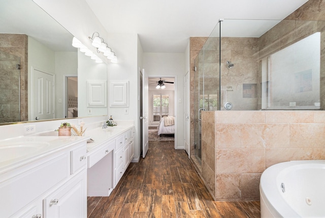 15814 Lake Loop Dr, Cypress, TX 77433 - bathroom with ensuite bath, a stall shower, double vanity, and a jetted tub