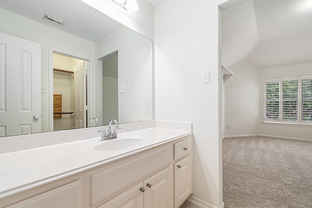 15814 Lake Loop Dr, Cypress, TX 77433 - bathroom with vanity and lofted ceiling